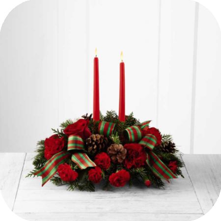 Newtown Floral Company Newtown - FTD® proudly presents the Better Homes and Gardens® Holiday Classics™ Centerpiece. Drawing from the rich traditions of holiday décor, this festive centerpiece is set to lend its seasonal beauty to your holiday celebrations. Bright red roses, carnations and mini carnations are arranged amongst an assortment of holiday greens, accented with natural pinecones and a designer red and green striped ribbon. Encircling 2 red taper candles, this lovely centerpiece will bring warmth and Christmas charm to your holiday gatherings with each graceful bloom.
GOOD centerpiece includes 8 stems.
Approximately 6"H x 15"W.
BETTER centerpiece includes 13 stems.
Approximately 6"H x 17"W.
BEST centerpiece includes 17 stems.
Approximately 7"H x 18"W.