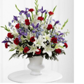 Superior Florist Ltd New York - The Cherished Farewell Arrangement is a patriotic and heartfelt floral tribute, blending the bold colors of red, white, and blue. This arrangement symbolizes a cherished farewell and pays homage to the memory of a loved one. The vibrant red blooms express passion and love, while the pristine white flowers signify purity and reverence. The addition of blue blossoms adds a patriotic touch, creating a visually striking and meaningful display. The Cherished Farewell Arrangement stands as a symbol of remembrance and honor, offering a dignified and patriotic tribute to celebrate the life and legacy of the departed.






