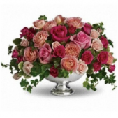 Superior Florist Ltd New York - A footed bowl overflowing with flowers.