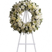 Superior Florist Ltd New York - The Serenity Wreath is a timeless and traditional floral arrangement crafted to evoke a sense of calm and peace. Composed with a thoughtful selection of blooms, this wreath embraces simplicity and elegance. The carefully arranged flowers form a circular display, symbolizing the cycle of life and the enduring nature of memories. The Serenity Wreath serves as a serene and respectful tribute, expressing condolences and providing comfort during moments of grief. With its classic design and understated beauty, this floral wreath offers a dignified and heartfelt way to honor the memory of a loved one.