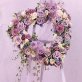 Superior Florist Ltd New York - The Open Heart of White, Pink & Lavender Roses is a tender and elegant floral arrangement symbolizing love and remembrance. This heartfelt tribute features an open-heart design adorned with a delicate selection of white, pink, and lavender roses. The purity of white roses, the softness of pink blooms, and the calming hues of lavender intertwine to create a visually captivating display. The open heart represents an outpouring of love and compassion, offering a beautiful and touching tribute to the departed. This arrangement serves as a symbol of enduring affection and is a thoughtful expression of condolences during times of loss and reflection.