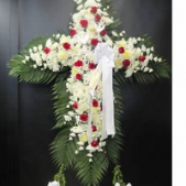 Superior Florist Ltd New York - A white cross with red roses, and an easel.