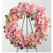 Superior Florist Ltd New York - The Loving Remembrance Wreath is a tender and heartfelt tribute displayed on an easel, adorned with shades of pink blooms. This wreath captures the essence of love and remembrance, with the soft and soothing tones of pink symbolizing affection and compassion. The carefully arranged shades of pink come together in a visually enchanting display, creating a loving and comforting atmosphere. The Loving Remembrance Wreath, presented on an easel, serves as a graceful expression of sympathy and support during moments of grief. Its gentle hues and elegant design convey warmth and solace, honoring the memory of a loved one with sensitivity and grace.