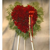 Superior Florist Ltd New York - A solid red rose heart on an easel.