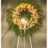 Superior Florist Ltd New York - The Yellow, Pink & Green Rose Wreath is a vibrant and lively floral arrangement crafted with an array of yellow, pink, and green roses. This wreath combines the cheerful energy of yellow roses, the soft elegance of pink roses, and the fresh vibrancy of green roses. The interplay of these hues creates a visually captivating and colorful display. The Yellow, Pink & Green Rose Wreath stands as a symbol of joy, love, and renewal. Whether used to celebrate a life well-lived or to express condolences, this wreath offers a beautiful and meaningful representation of the diverse emotions associated with remembrance and love.






