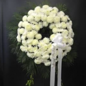 Superior Florist Ltd New York - The Pure White Wreath is a solemn and elegant arrangement, crafted with an array of all-white chrysanthemums. This standing wreath symbolizes purity, reverence, and a sense of serenity. The carefully selected white chrysanthemums come together circularly, creating a visually stunning and peaceful display. The Pure White Wreath serves as a dignified tribute and expression of condolences during moments of grief. Its simplicity and purity make it a fitting choice for honoring the memory of a loved one with grace and respect. This standing wreath stands as a symbol of everlasting love and remembrance.





