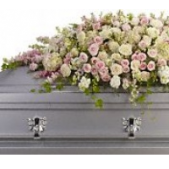 Superior Florist Ltd New York - The "I Always Adored" Casket Spray is a tender and elegant arrangement featuring soft pink, cream, and white exquisite flowers. This delicate combination of colors creates a visually stunning and emotionally comforting display. The gentle hues convey a sense of love, admiration, and fond memories. The "I Always Adored" Casket Spray serves as a beautiful and heartfelt expression of love and remembrance, offering solace and comfort during moments of grief. Its soft and elegant design pays tribute to the cherished moments shared with a loved one, leaving a lasting impression of beauty and grace