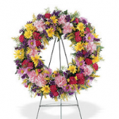 Superior Florist Ltd New York - The Eternity Wreath is a beautiful expression of love and support, featuring a vibrant mix of colorful flowers. This wreath radiates with bright hues, symbolizing the joy, love, and cherished memories associated with the departed. Its lively and varied composition brings a sense of celebration to the service, honoring the life and spirit of the individual. The Eternity Wreath stands as a heartfelt gesture, offering a visual representation of enduring love and support during moments of grief. Its colorful display serves as a loving tribute, bringing comfort and warmth to those in attendance.






