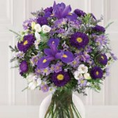 Superior Florist Ltd New York - Lavender and purple flowers in a vase.
