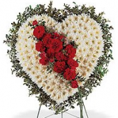Superior Florist Ltd New York - The White Heart with Rose Cluster is a beautiful and heartfelt family tribute, combining the symbolic heart shape with a cluster of roses. Crafted in pure white, the heart represents love, unity, and everlasting memories. The addition of a rose cluster brings a touch of warmth and affection to the arrangement. The white color symbolizes purity, reverence, and the hope for peace. This arrangement stands as a poignant and elegant expression of love and remembrance, suitable for honoring the memory of a beloved family member. It serves as a visual tribute, conveying deep emotions and offering comfort during moments of grief.





