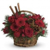 Superior Florist Ltd New York - Red flowers and Christmas greenery accented with fragrant pine cones.