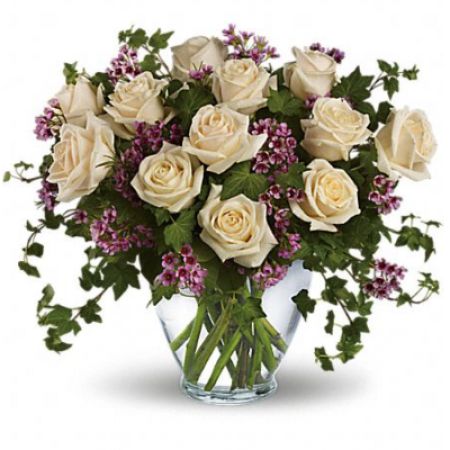 Superior Florist Ltd New York - Creamy Roses stand out against Greens and Waxflower to make a simple, yet elegant arrangement. 