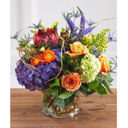 Superior Florist Ltd New York - The Harlem Shuffle is a beautiful arrangement featuring deep purple hydrangea and veronica, contrasting against bright oranges to create a vibrant and visually striking display. This lively composition is designed to brighten anyone's day. With the option for same-day flower delivery, The Harlem Shuffle allows you to promptly share this stunning arrangement for various occasions. Whether it's to express joy, celebrate, or simply add a touch of vibrancy to someone's day, this arrangement captures the lively spirit of Harlem in a chic and thoughtful floral presentation.






