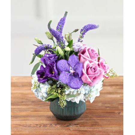 Superior Florist Ltd New York - "The Broadway Express" is a compact and stunning centerpiece featuring deep purple lisianthus, veronica, and orchids alongside pink roses and white hydrangea. With the option for same-day flower delivery, you can promptly share this elegant and vibrant arrangement for various occasions. The combination of rich purples, pinks, and whites creates a visually striking and harmonious display, making "The Broadway Express" a chic and thoughtful choice for floral gifting. Whether it's for a special celebration, a romantic evening, or to add a touch of sophistication to any space, this centerpiece captures the essence of beauty and elegance.





