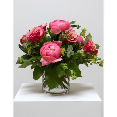Uptown Blossoms Anchorage - 6 roses and 3 peonies in a cylinder vase. Colors will vary. Available while supplies last. This is a discounted price.