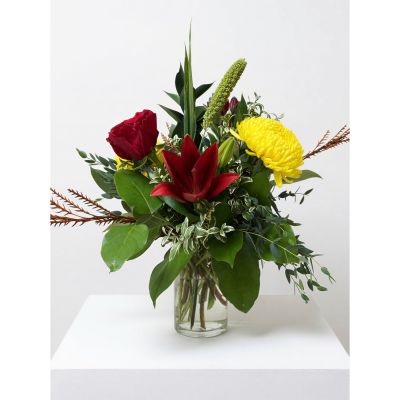 Uptown Blossoms Anchorage - Embrace the warmth of the season with ‘Classic Fall’, a vibrant bouquet bursting with rich reds, golden yellows, and earthy bronze hues.
Gerbera daisies, cheerful lilies, and rustic chrysanthemums mingle together, evoking cozy afternoons and grateful moments.
Presented in a simple glass vase and tied with twine, it’s a perfect centerpiece for your home or a heartfelt gift to brighten someone's day. 
Send autumnal joy with this stunning fall flower arrangement – a beautiful expression of warmth and appreciation.