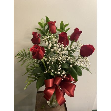 Boulder City Florist Boulder City - Celebrate love with our Half-Dozen Rose Arrangement, artistically designed in a vase with greens, filler, and a charming bow. This elegant ensemble is a perfect way to express your sentiments. Enjoy the convenience of same-day delivery, ensuring your thoughtful arrangement arrives promptly, creating a beautiful moment for your special occasion.






