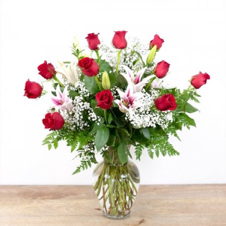 Boulder City Florist Boulder City - Our 'Timeless Jewel" melds the beautiful elegance of premium long-stem red roses with a beautiful, fragrant stargazer lilies in pinks and whites, all accented with seasonal greenery in a traditional glass vase. This is one of our most popular pieces and a perfect choice to express your love and affection.

Arrangement (1 doz) is approximately 24"H x 20"W and includes 12 roses and 4 stems of stargazer lilies
Select our 2 Dozen or 3 Dozen for a bigger presentation.