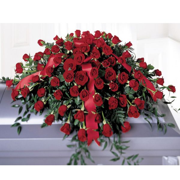 Boulder City Florist Boulder City - Dozens of red roses intertwined with greens in a traditional casket spray selection. 