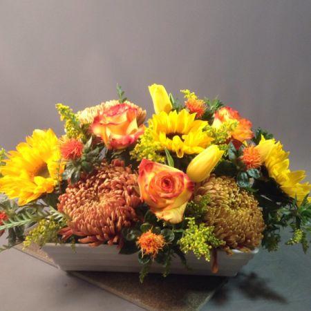 Bouquets Denver - Thanksgiving centerpiece with sunflowers, roses, mums, and other seasonal flowers.