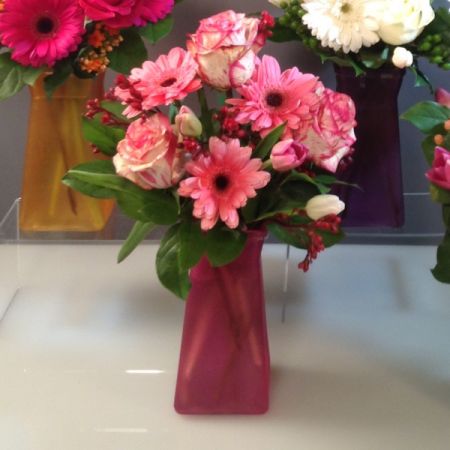 Bouquets Denver - Sweetness in a vase. Colored roses, bright Gerbera daisies, crisp Spring Tulips, and textural accents. Romantic colors will vary and will be assigned randomly. Vase pictured is subject to availability and will be substituted if necessary.