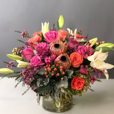 Bouquets Denver - Experience the beauty of a lush garden mix bursting with fresh spring colors, promising to add vibrancy to any space. Enjoy the convenience of same-day flower delivery, ensuring this delightful arrangement promptly graces your home or event. Immerse yourself in the enchanting array of blossoms, capturing the essence of the season. Elevate your surroundings with this thoughtfully curated garden-inspired bouquet, a perfect celebration of nature's rejuvenation. Make a statement with the lively hues and textures that create a visually captivating and refreshing display. Delight in the beauty of spring brought to life in this blooming ensemble, a perfect gift or decoration for any occasion. Floral selection will vary with the season, but will always include our showiest, most premium flowers.