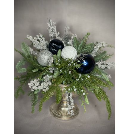 Bouquets Denver - Celebrate the season with a wonderful arrangement featuring evergreens and holiday balls adorned with faux ice crackles, all assembled in a silverplate metal footed urn. Opt for an upgrade with fresh blossoms to add a burst of natural beauty to the ensemble. Enjoy the convenience of same-day flower delivery, ensuring your festive display graces your space promptly. This charming combination of greenery and holiday accents brings a touch of winter magic to your surroundings. Elevate the elegance of your decor with the option to include vibrant fresh blossoms for an extra layer of festive cheer. Make a statement with this delightful arrangement that captures the spirit of the holidays.