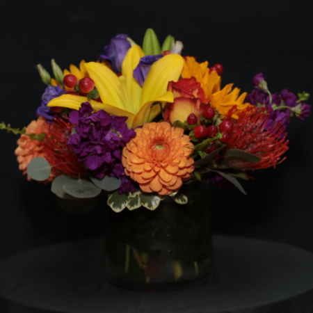 Ninth Street Flowers Durham - A compact, European Style arrangement featuring Fall flowers in jewel tones.