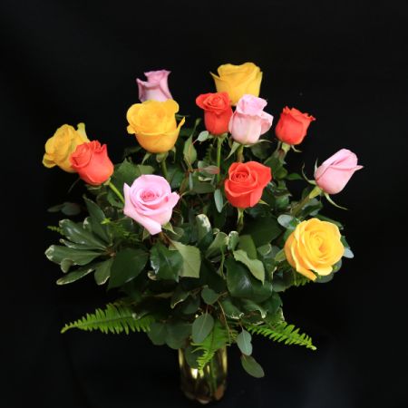 Ninth Street Flowers Durham - Three  colors of long-stemmed roses, accented with lush mixed green foliage. 
Colors will vary seasonally.