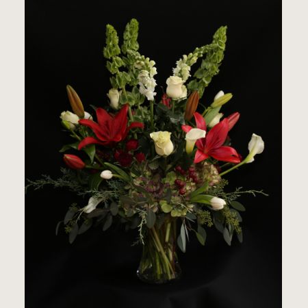 Ninth Street Flowers Durham - Lush selection of holiday reds and whites with winter accents.